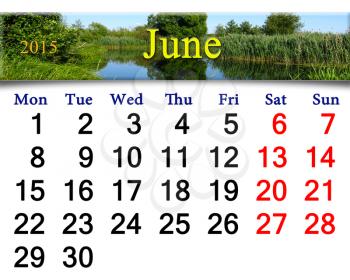 calendar for June of 2015 year on the background of forest lake