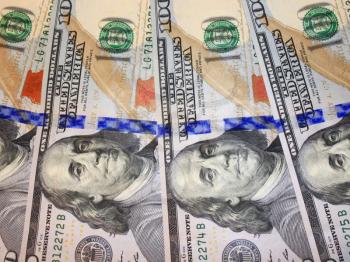 hundred dollar bank note with image of president Benjamin Franklin