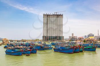 Bay with fishing boats in Nha Trang, Vietnam in a summer day