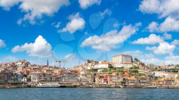 Tourist boat and Douro River in Porto in a beautiful summer day, Portugal
