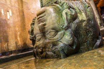 Medusa head in the Basilica Cistern in Istanbul, Turkey in a beautiful summer day