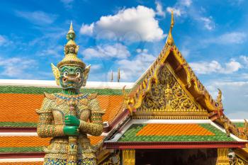 Demon Guardian in Wat Phra Kaew (Temple of the Emerald Buddha), Grand Palace in Bangkok in a summer day