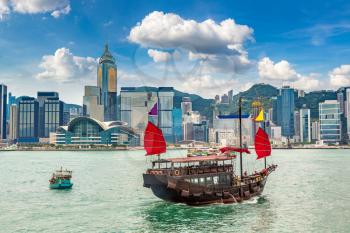 Traditional Chinese wooden sailing ship in Victoria Harbour in Hong Kong at summer day