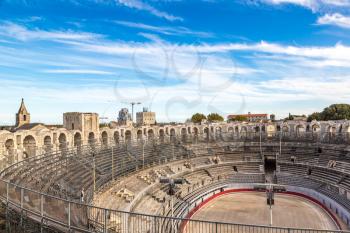 Arena and roman amphitheatre in Arles, France in a beautiful summer day