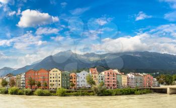 Building facade and Alps mountains behind in Innsbruck in a beautiful summer day, Austria