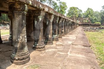 Baphuon temple ruins is Khmer ancient temple in complex Angkor Wat in Siem Reap, Cambodia in a summer day