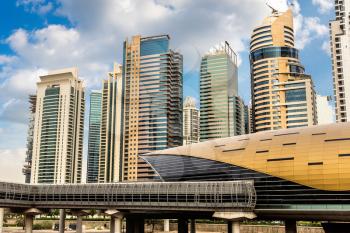 Futuristic metro station in Dubai in a summer day, United Arab Emirates