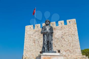 Statue of Barbaros Hayreddin Pasha and Pirate castle on Pigeon Island in Kusadasi, Turkey in a beautiful summer day