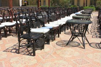  Terrace with tables and chairs on sunny day