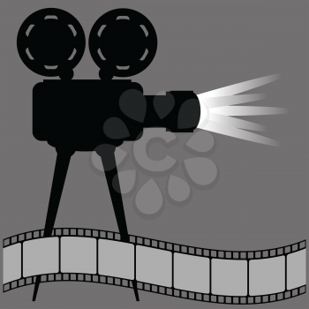 old movie projector silhouette and film strip on a gray background