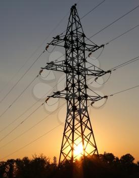 High-voltage power lines. electricity distribution at sunset. high voltage electric transmission tower.