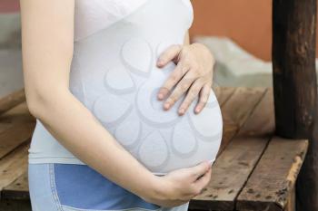 Image of pregnant woman in blue clothes