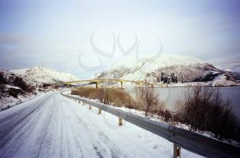 Winter scenery with bridge between islands in Norway