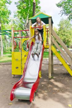 Photo of two active girls on nursery platform