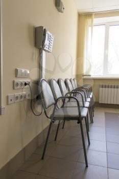 Photo of row chairs in empty corridor
