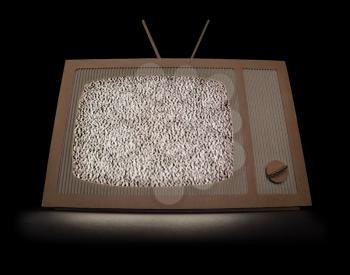 TV made of cardboard with white noise on a screen. Isolated on black.