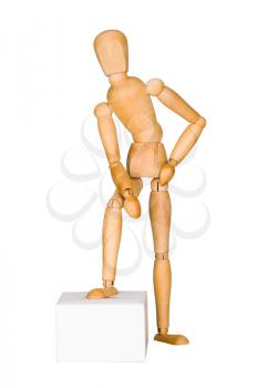 Wooden mannequin lean on the box.  Isolated on white.