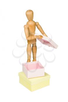 Wooden mannequin opens a gift box, isolated on white