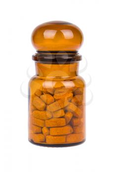 Brown vintage bottle with pills isolated on white