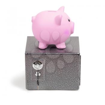 Pink ceramic piggy bank standing on a safe, isolated on white background. Keeping money in a safe or a bank, or in a piggy bank, economy, financials investments, savings for buying a house, a car, for retirement concept.
