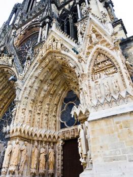 Entrance in gothic catholic Notre-Dame Cathedral in Reims, France