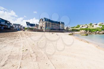 urban sand beach in breton town Perros-Guirec in summer day, France