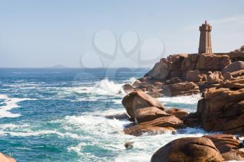lighthouse in the rocks on Brittany Pink Granite Coast in France