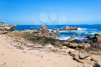 Breton stone beach in sunny day