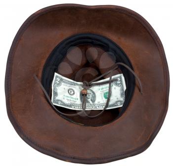 Leather brown cowboy hat with 2 dollars banknote within