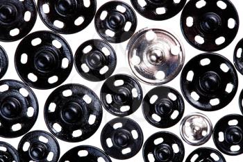 many different metal buttons isolated on white