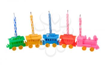 toy train with celebrate candles isolated on white