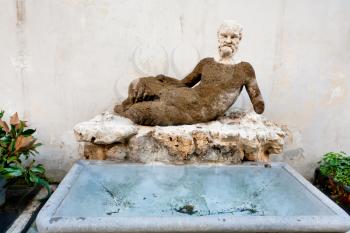 antique Silenus statue on via del Babuino, Rome, Italy