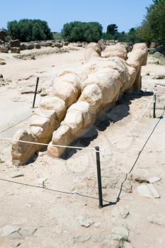 antique Atlant sculpture in Valley of the Temples, Agrigento, Sicily