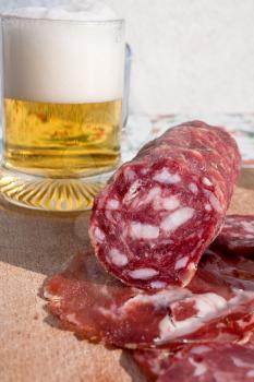 italian sausage and glass of beer outdoor