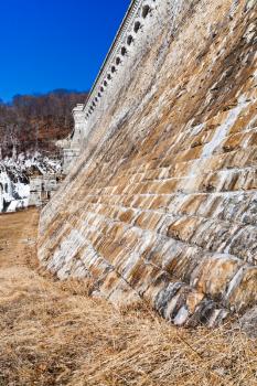 old stone brick wall of water dam