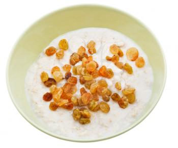 traditional english oat porridge with raisins in yellow bowl isolated on white background