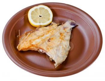 fried sole fish on brown plate isolated on white background