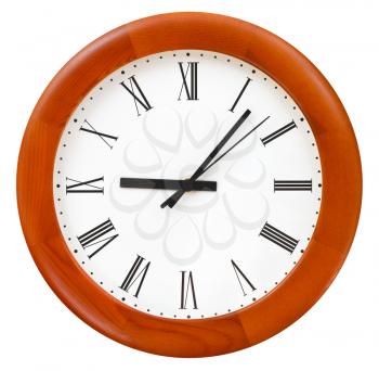 six minutes past nine on round dial wall clock