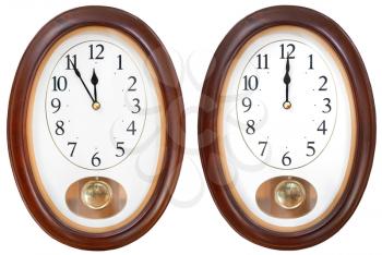 twelve o clock on oval dial clock isolated on white backgground