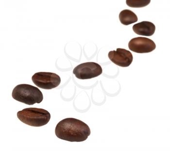 sinuous line pattern from roasted coffee beans with focus foreground