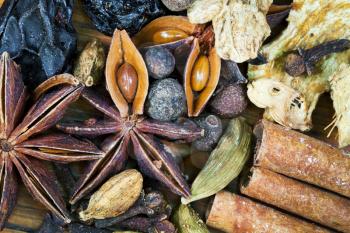 various spices for mulled wine on wooden table