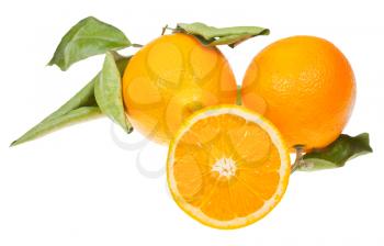 one sliced orange and two oranges with green leaves isolated on white background