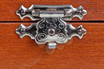 metal latch of wooden box close up