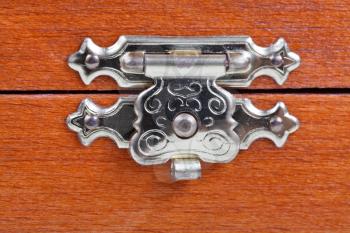 metal latch of wooden case close up