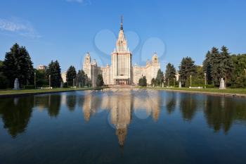 panoramic view of main building of Moscow State University and fountain pond in summer day