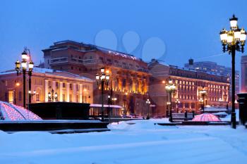 snow in Moscow - view of snow covered Manege square in winter snowing evening
