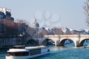view of Pont Neuf with Eiffel Tower and French Academy on background in Paris