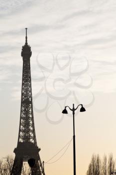 urban lantern and eiffel tower in Paris on pink yellow sunset