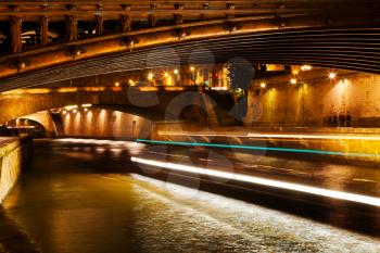 pont au Double and Seine river in Paris at night