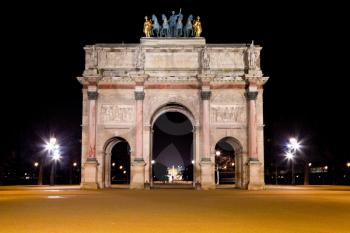 The Arc de Triomphe du Carrousel at night in Paris, France